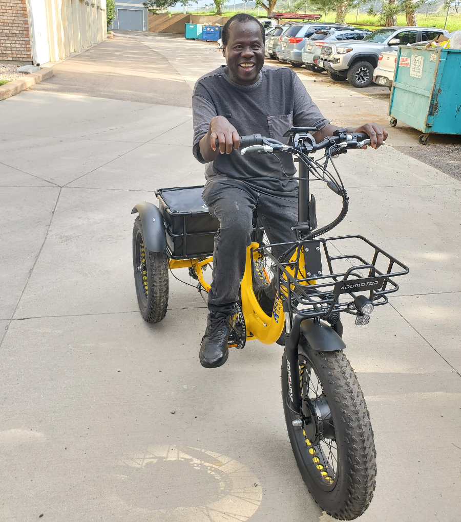 Person on a yellow electric trike