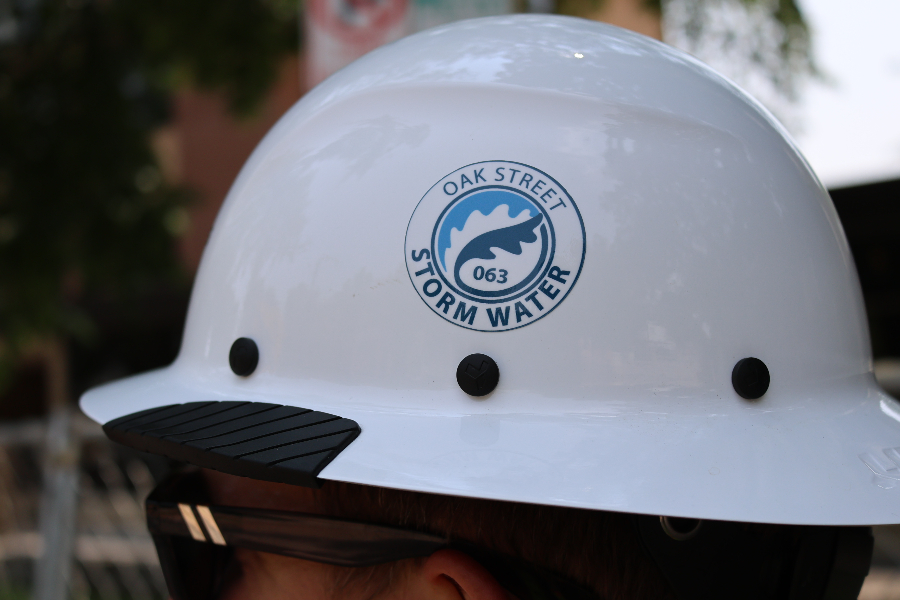 Construction helmet with Oak St Stormwater logo