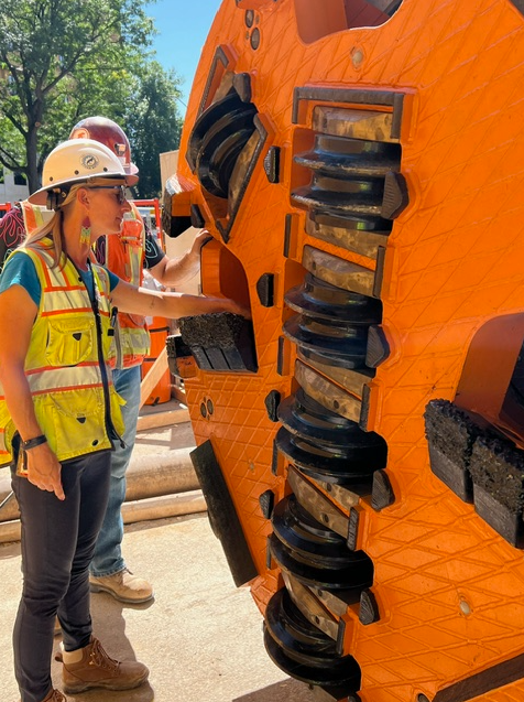 Project manager standing with the tunneling equipment