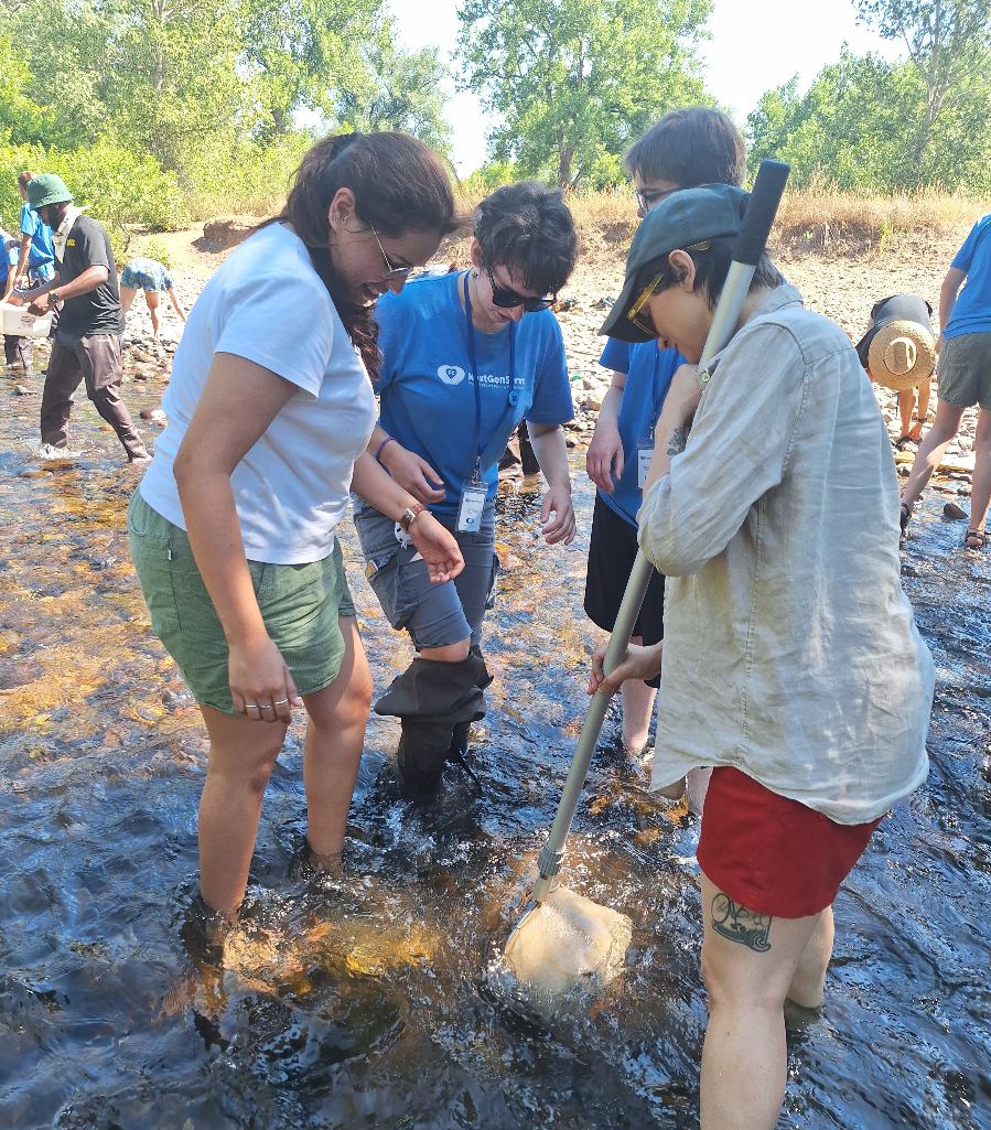 Teens and Utilities staff testing water quality in the Poudre River.